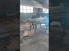 The fence connector is being welded to the fence post