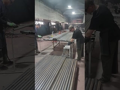 Guardrail accessories are being welded to the guardrail posts