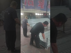 Fence posts are being polished and stacked